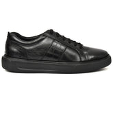 Side view of black leather sneakers from Country Maddox